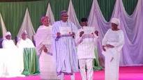 Buhari and Osinbajo with the certificates of return