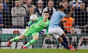chelsea keeper in action against man city