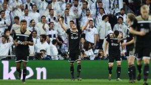 Ajax players celebrate their historic win