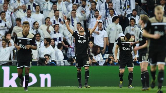 Ajax players celebrate their historic win