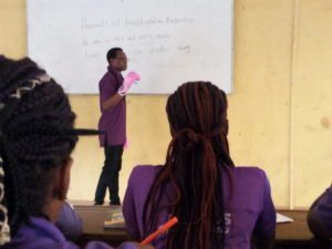 The lecturer delivering lecture in the classroom