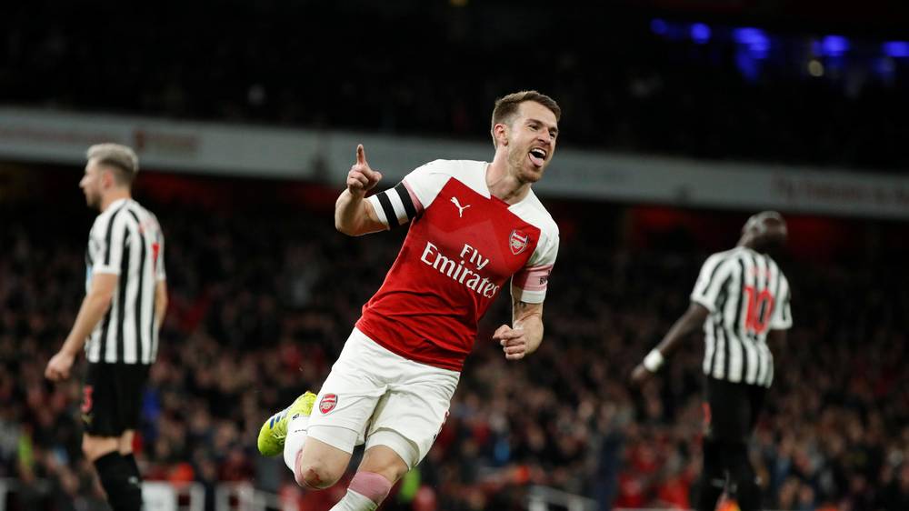 Aaron Ramsey celebrates after he scored against Newcastle
