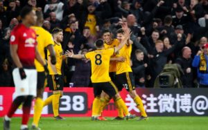 Wolves players celebrate after beating Manchester United