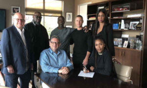 Tiwa Savage signing her record deal with Universal Music Group.