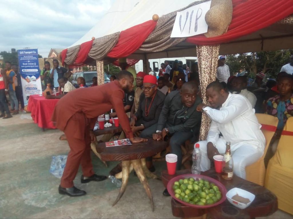 Dr Emeka Okeke and ABS MD, Nze Uche Nworah on red cap discussing, while Obiano's Protocol officer Uzu and another guest discuss