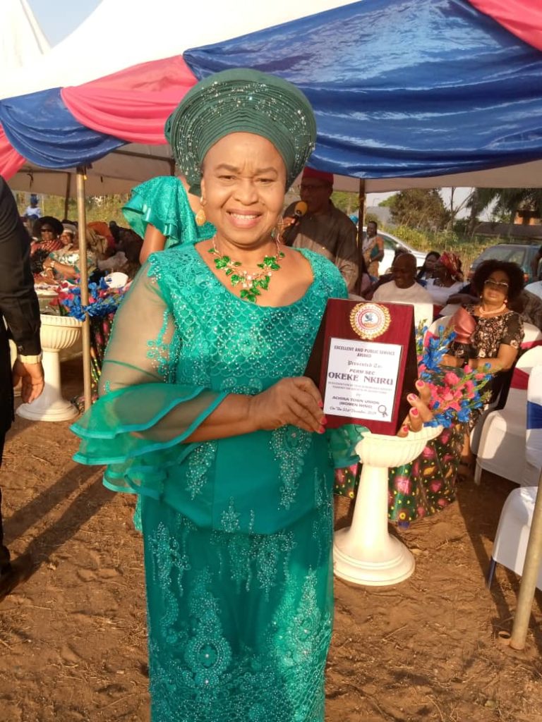 Former perm sec , Lady Okeke receiving award