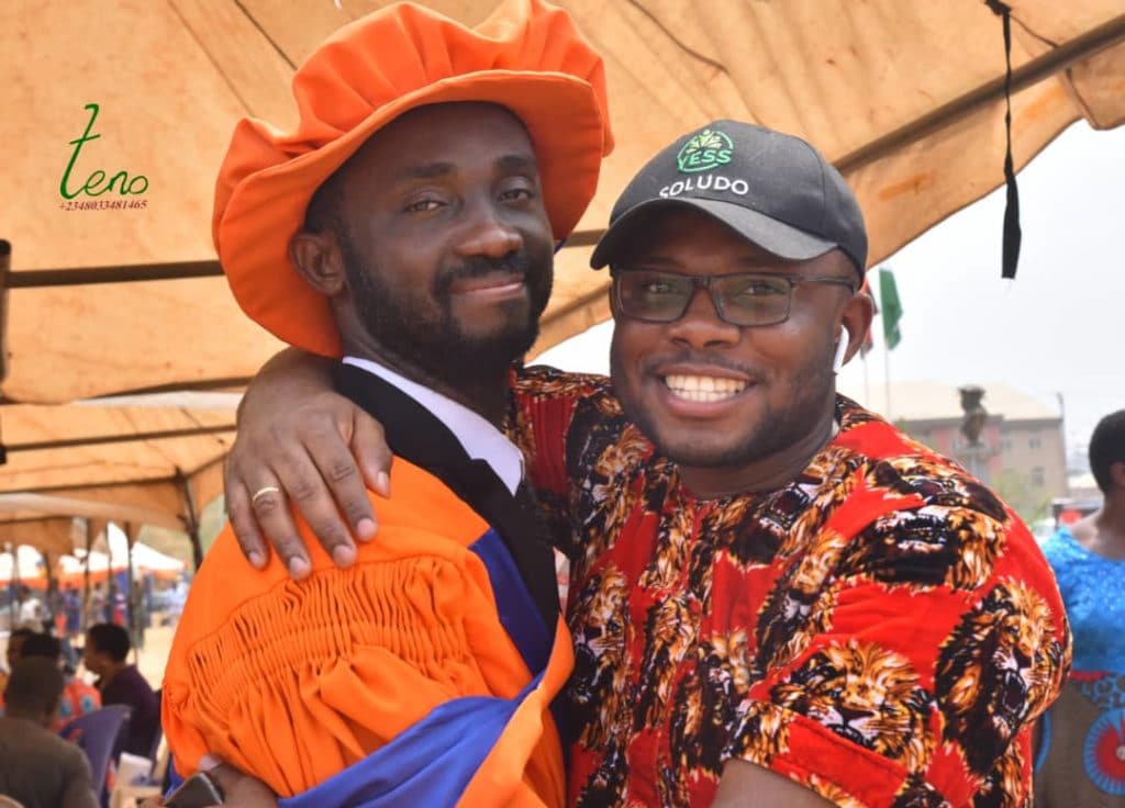  Dr Odogwu Emeka Odogwu, PhD and Comrade Nelson Omenugha, former SUG President Unizik in a warm embrace. He is awaiting his PhD convocation in China. 