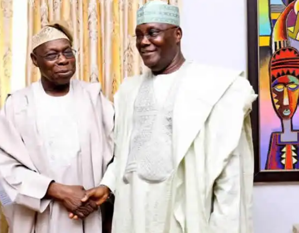 Obasanjo shaking hands with Atiku